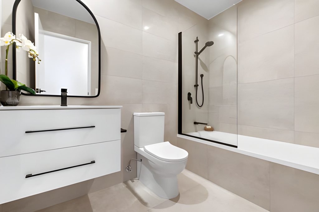 Modern bathroom with sleek black accents.