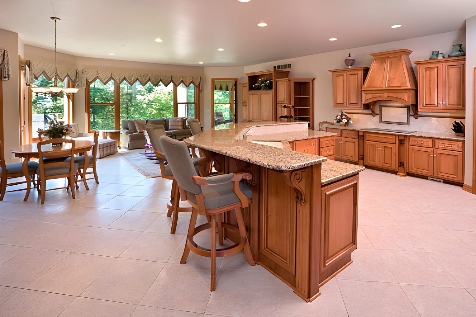 Open-concept kitchen with wooden cabinets and island.